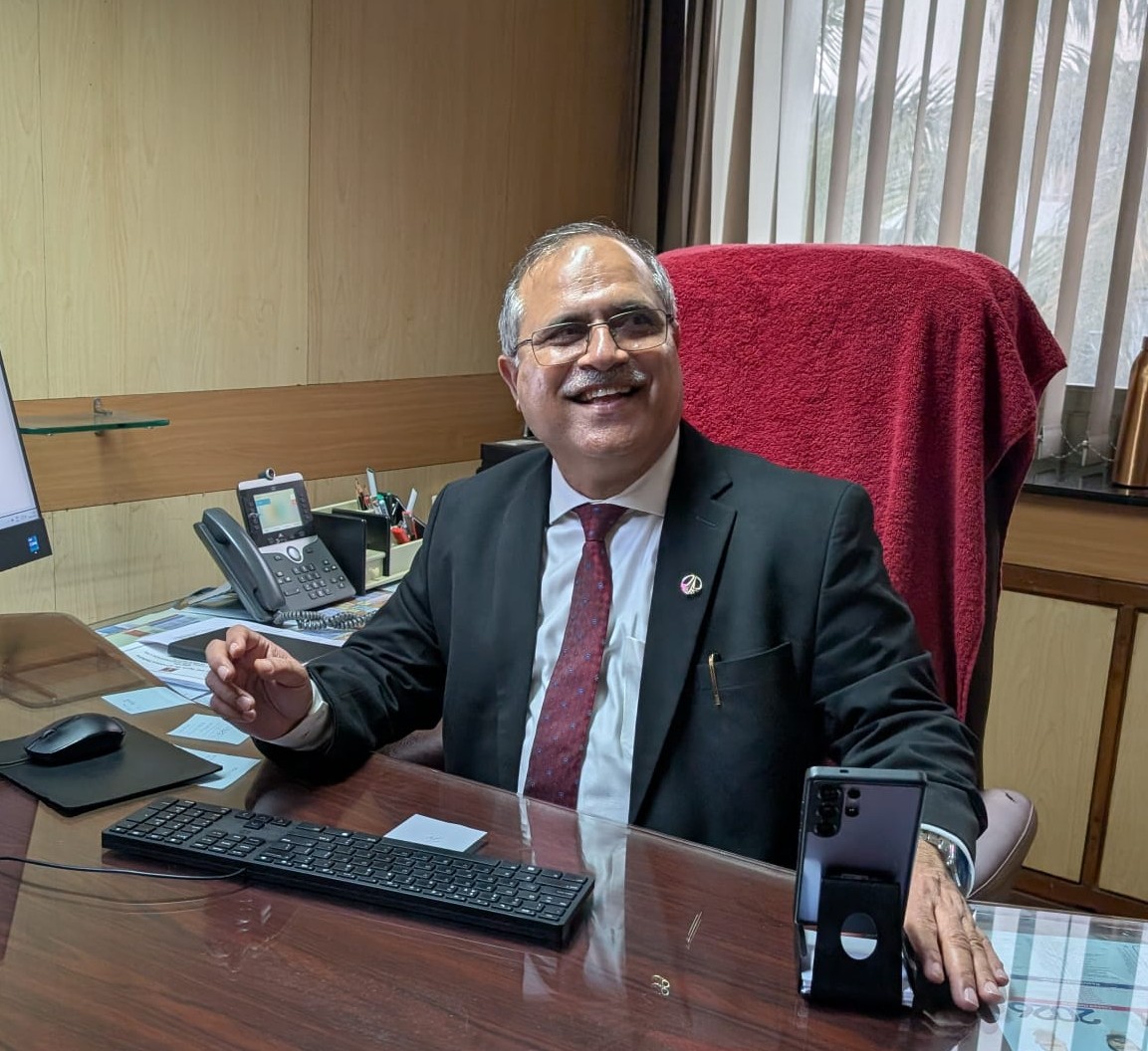 Adarsh Kumar Malpotra at his office desk